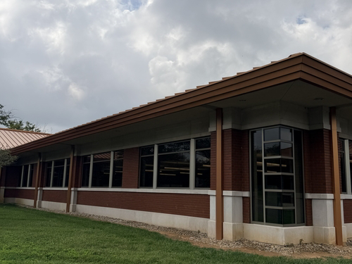 Office building with a standing-seam metal roof in the Louisville area.